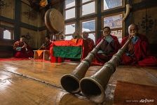 Playing a musical instrument during a puja